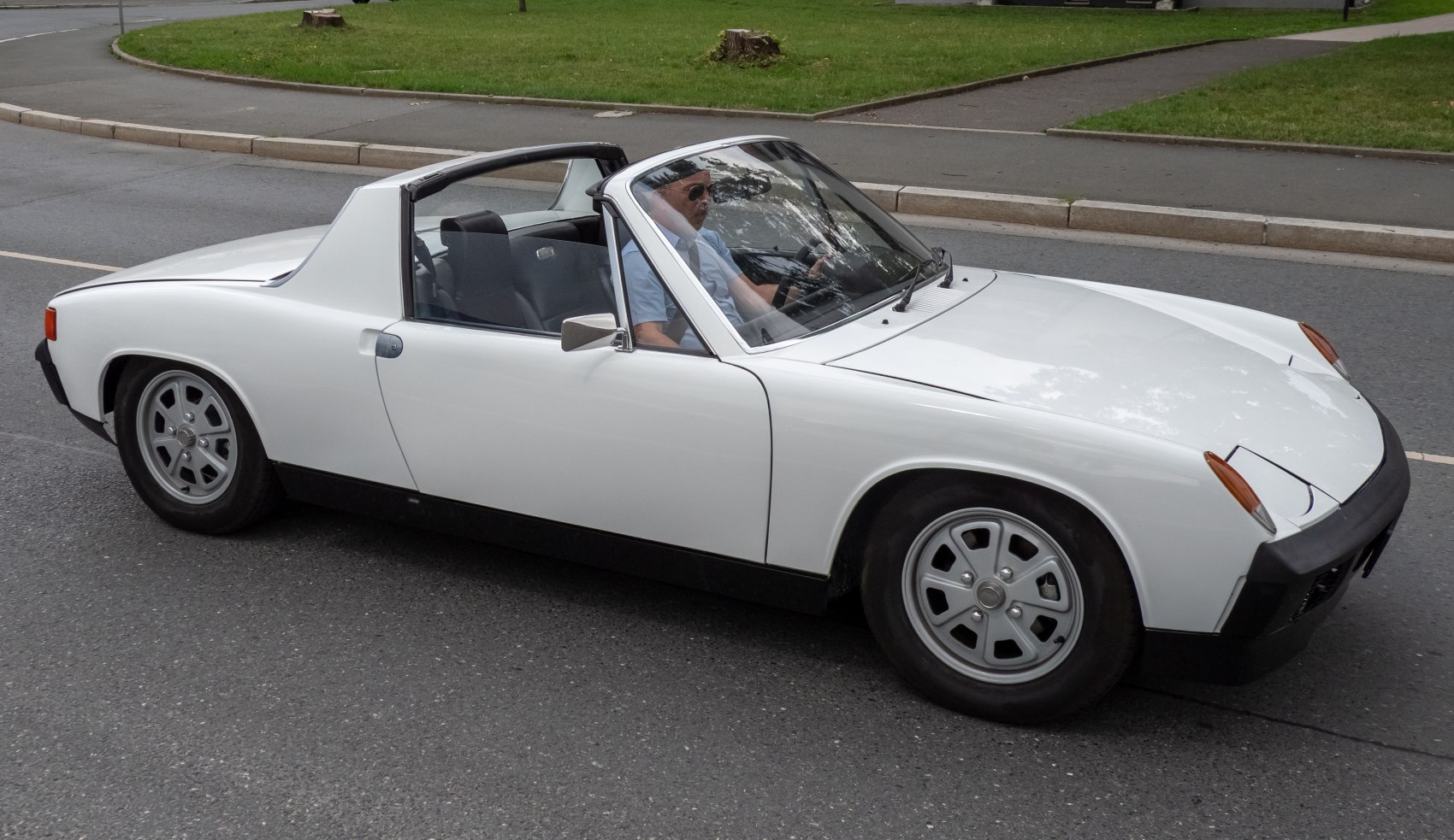 Targa roof and sleek side profile of a vintage sports car