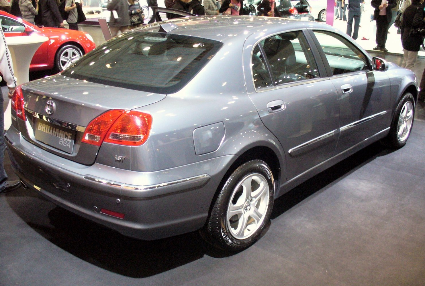 Rear and side profile of a silver four-door sedan