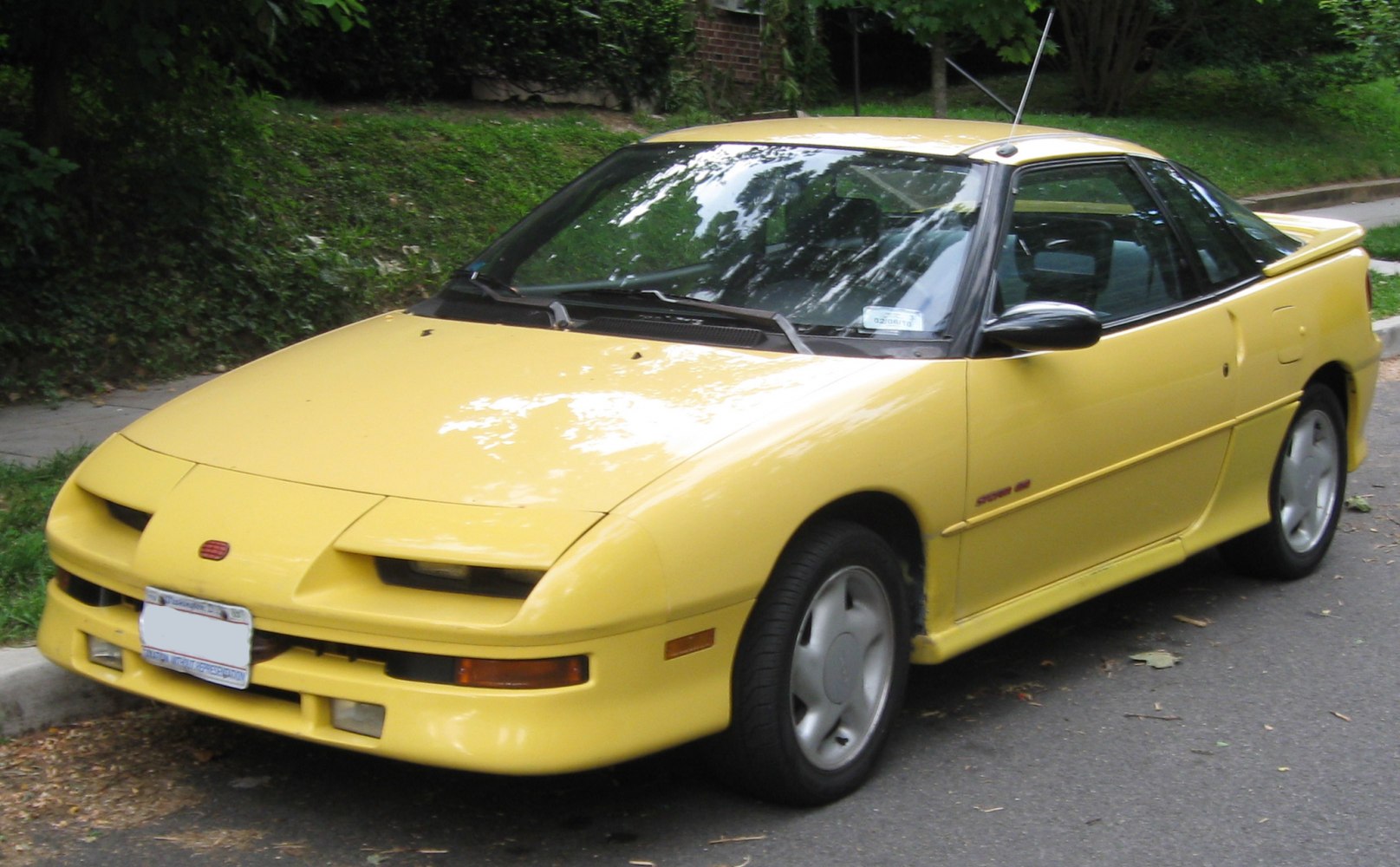 Pop-up headlights and compact sporty coupe design