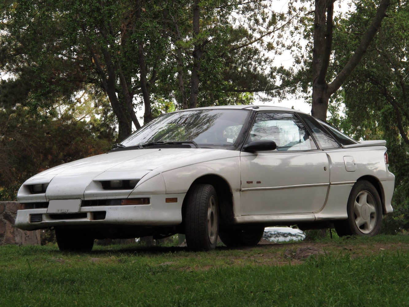 Pop-up headlights and rear spoiler on classic two-door coupe