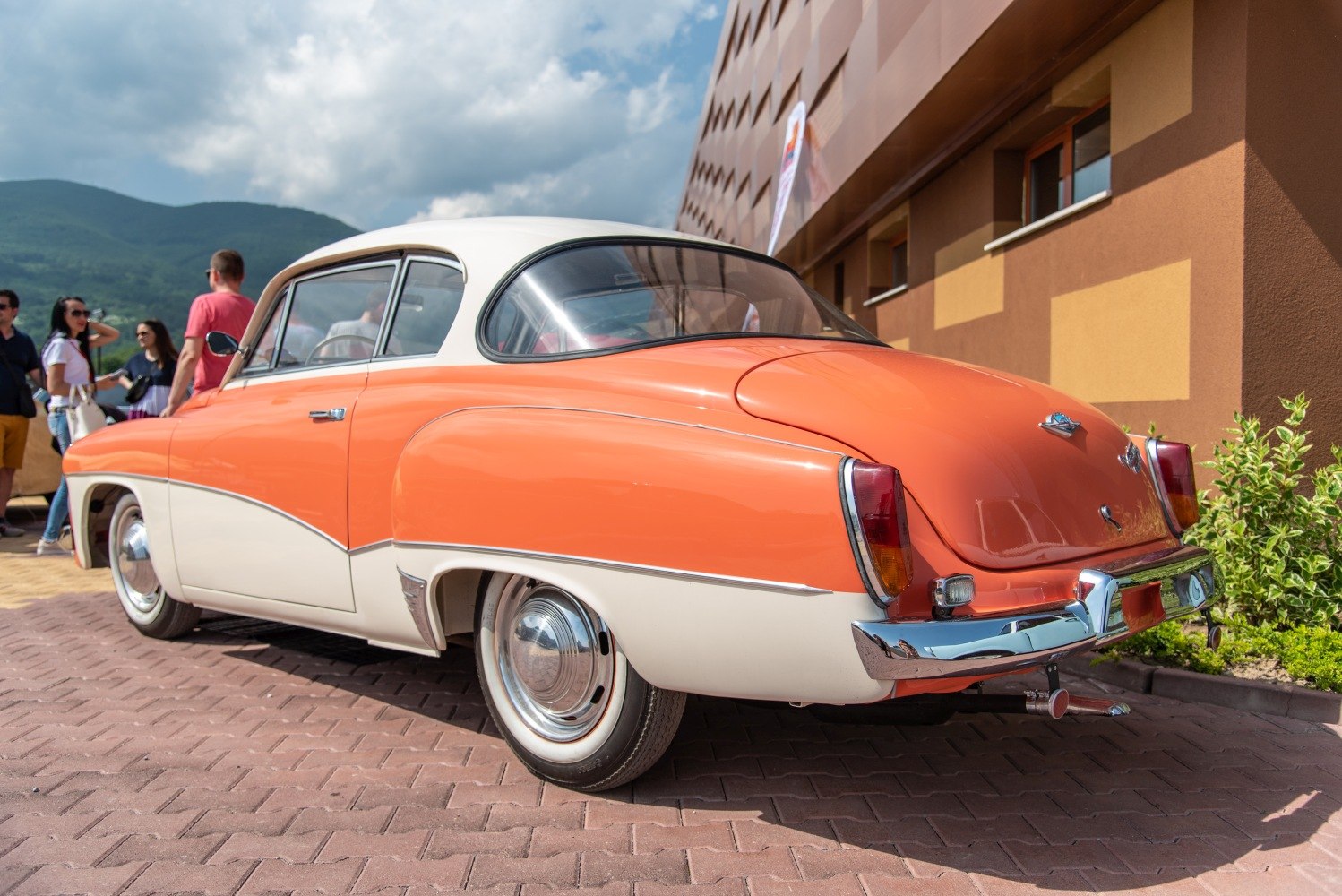 Retro two-tone coupe rear with chrome bumper and smooth curves
