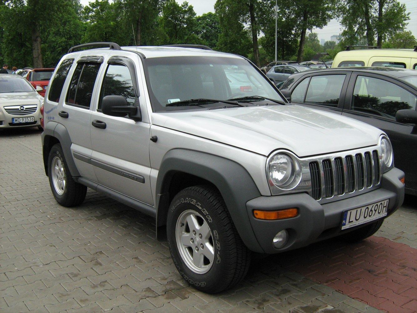 Rugged SUV with seven-slot grille and round headlights