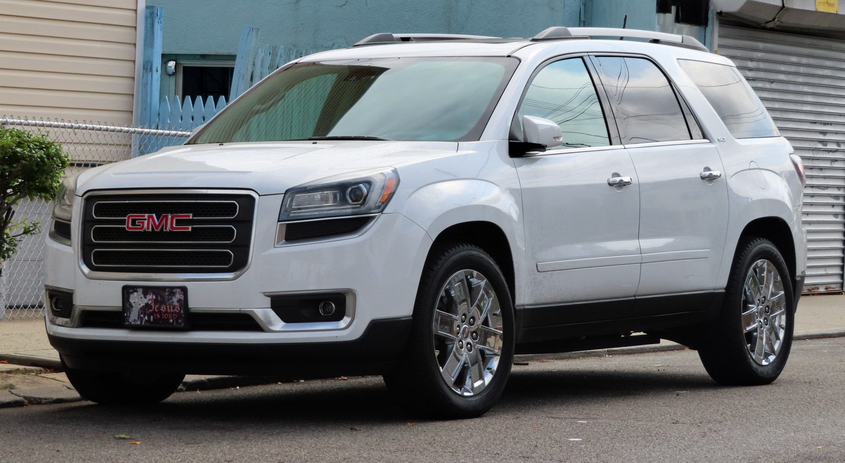 White SUV with strong grille and modern headlights