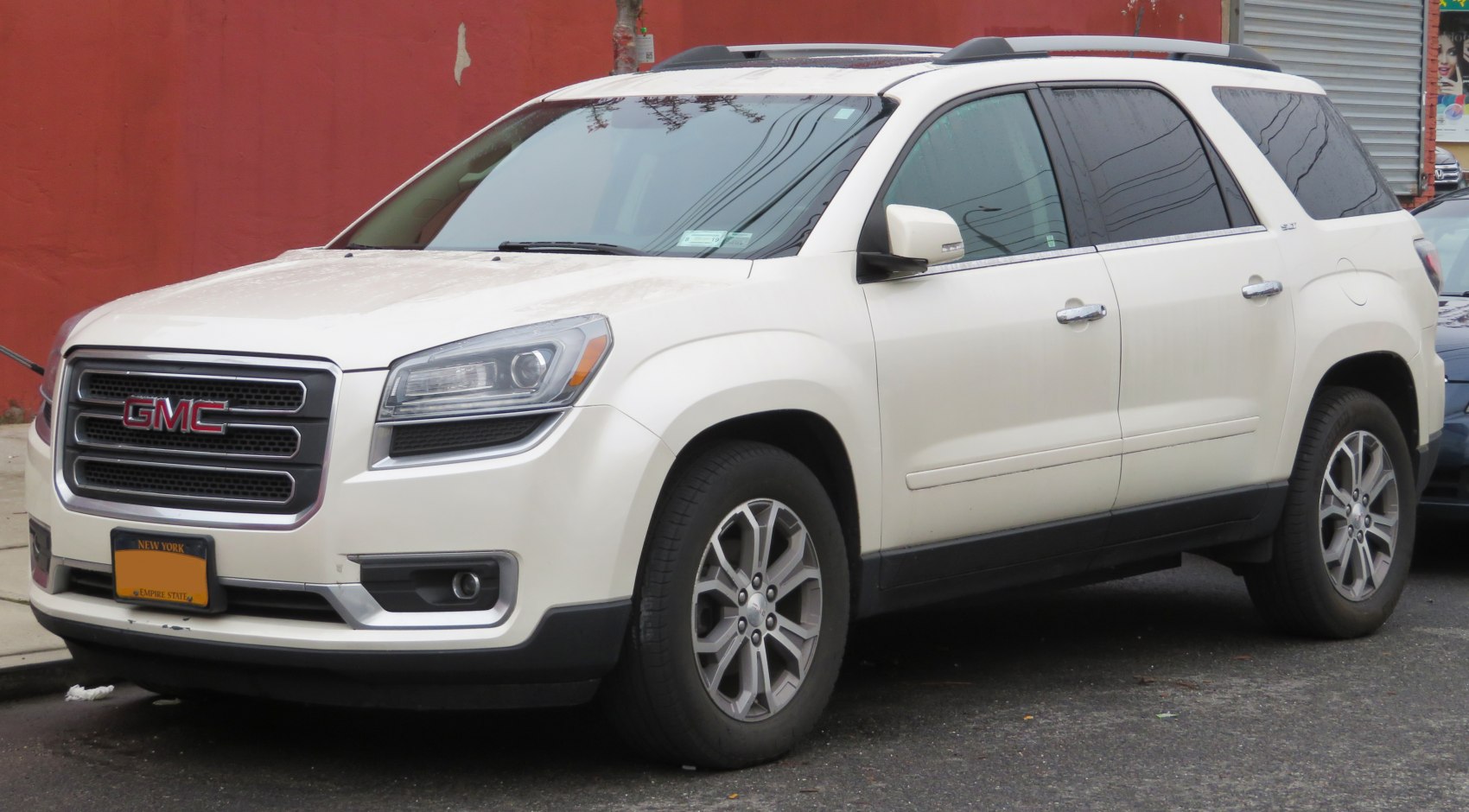 Front grille, headlights, alloy wheels on white SUV