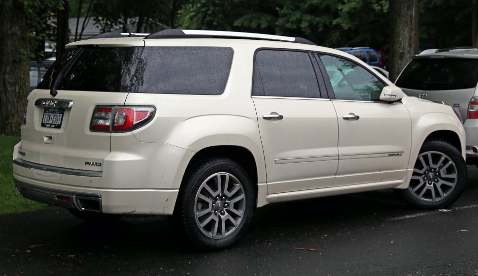 Rear side profile of a white SUV with AWD badge and alloy wheels