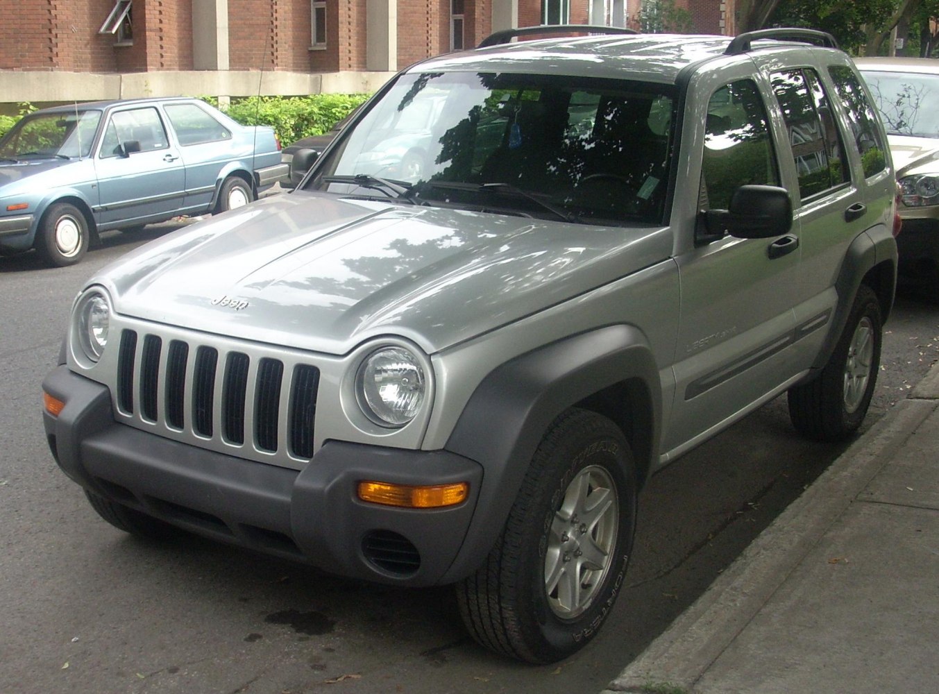 Front SUV with rounded headlights and vertical grille