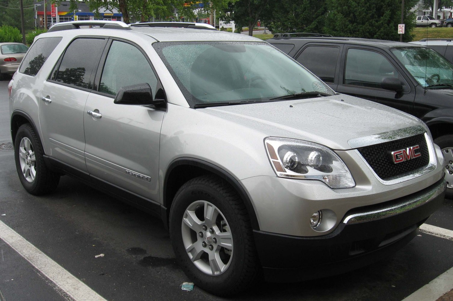 Silver SUV front-side view with distinct headlights and grille.