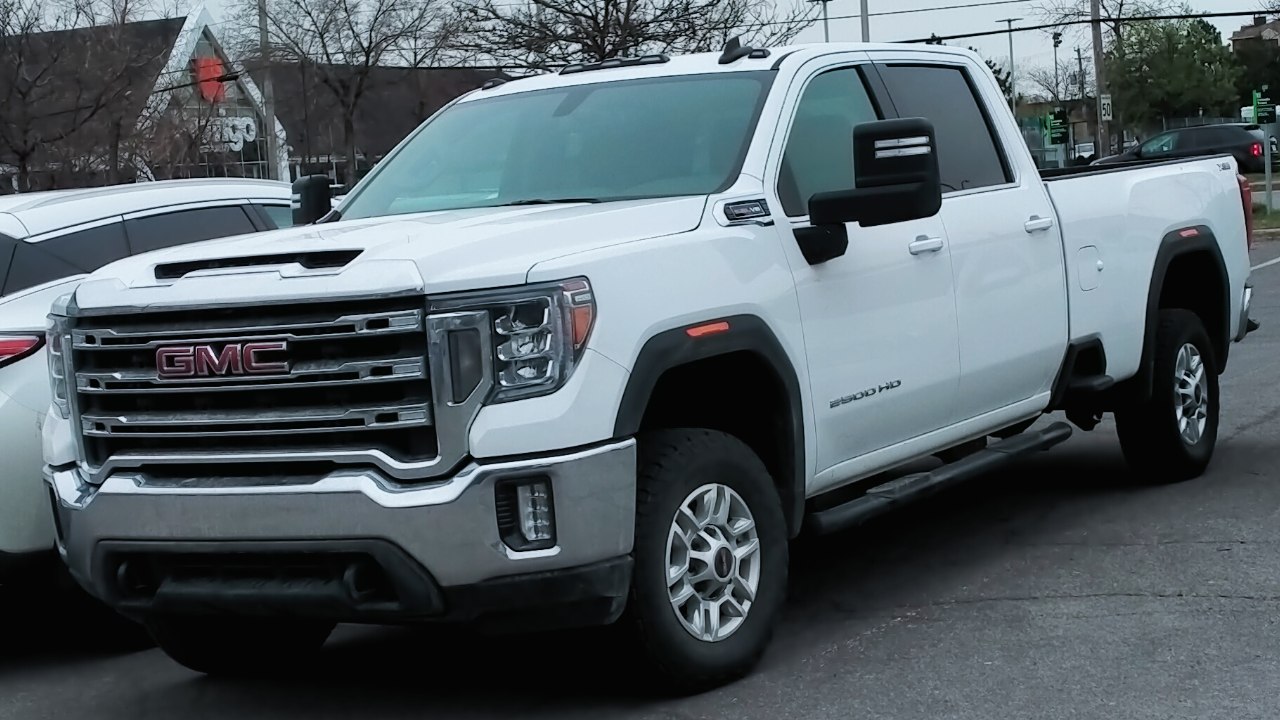 White full-size pickup truck with crew cab and standard cargo box