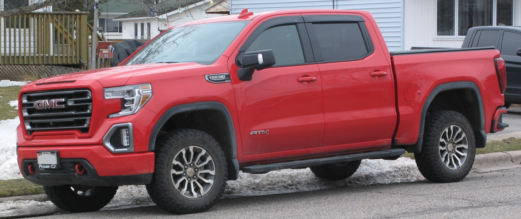 Red pickup with crew cab, short box, LED lights, off-road tires