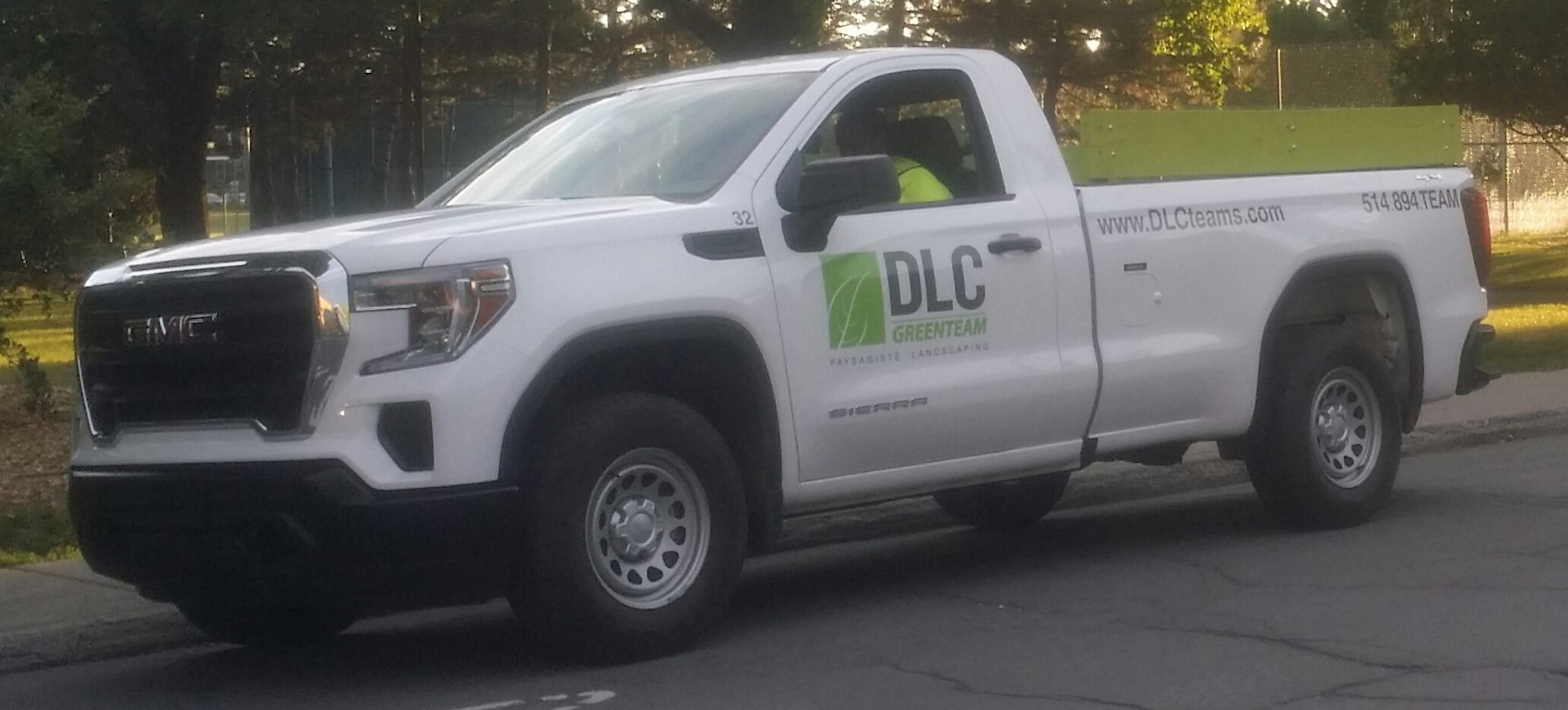 White pickup truck with regular cab and long utility bed