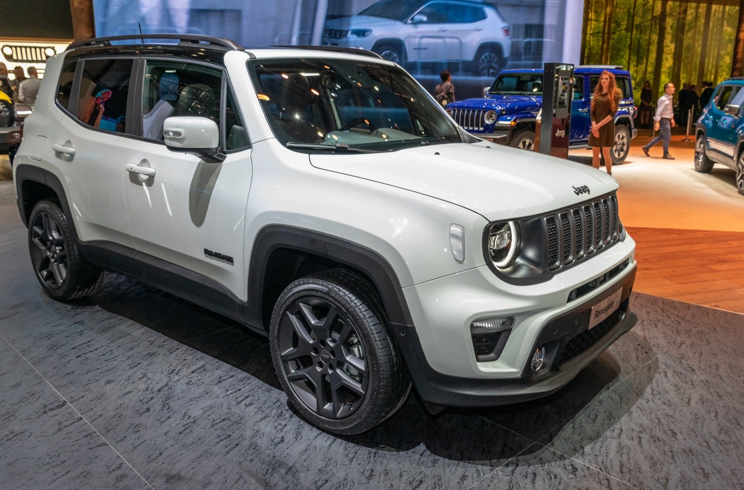 Front and side view with round headlamps and black rims.