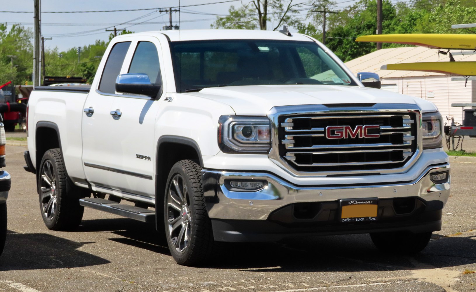 Front and side view with prominent grille and headlights