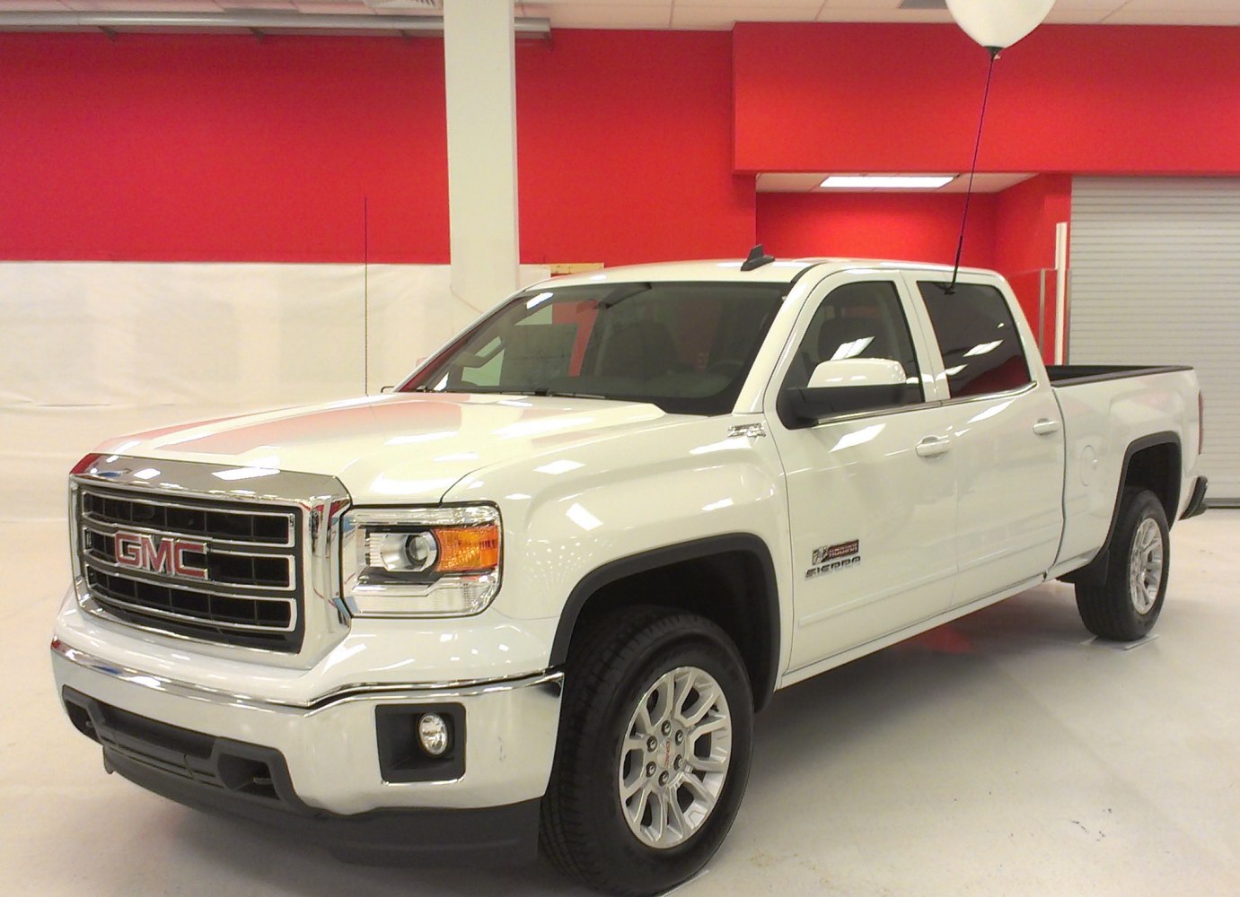 Full-size pickup with crew cab and standard box in white color