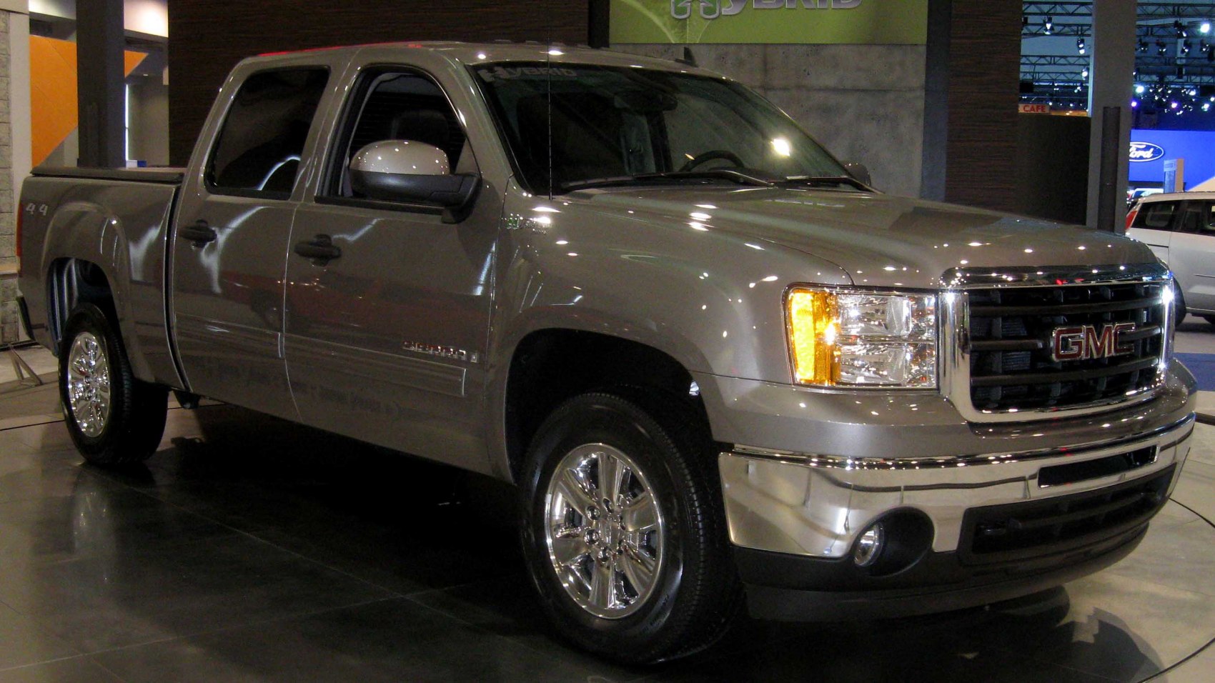 Front and side profile of full-size pickup with chrome grill and headlights