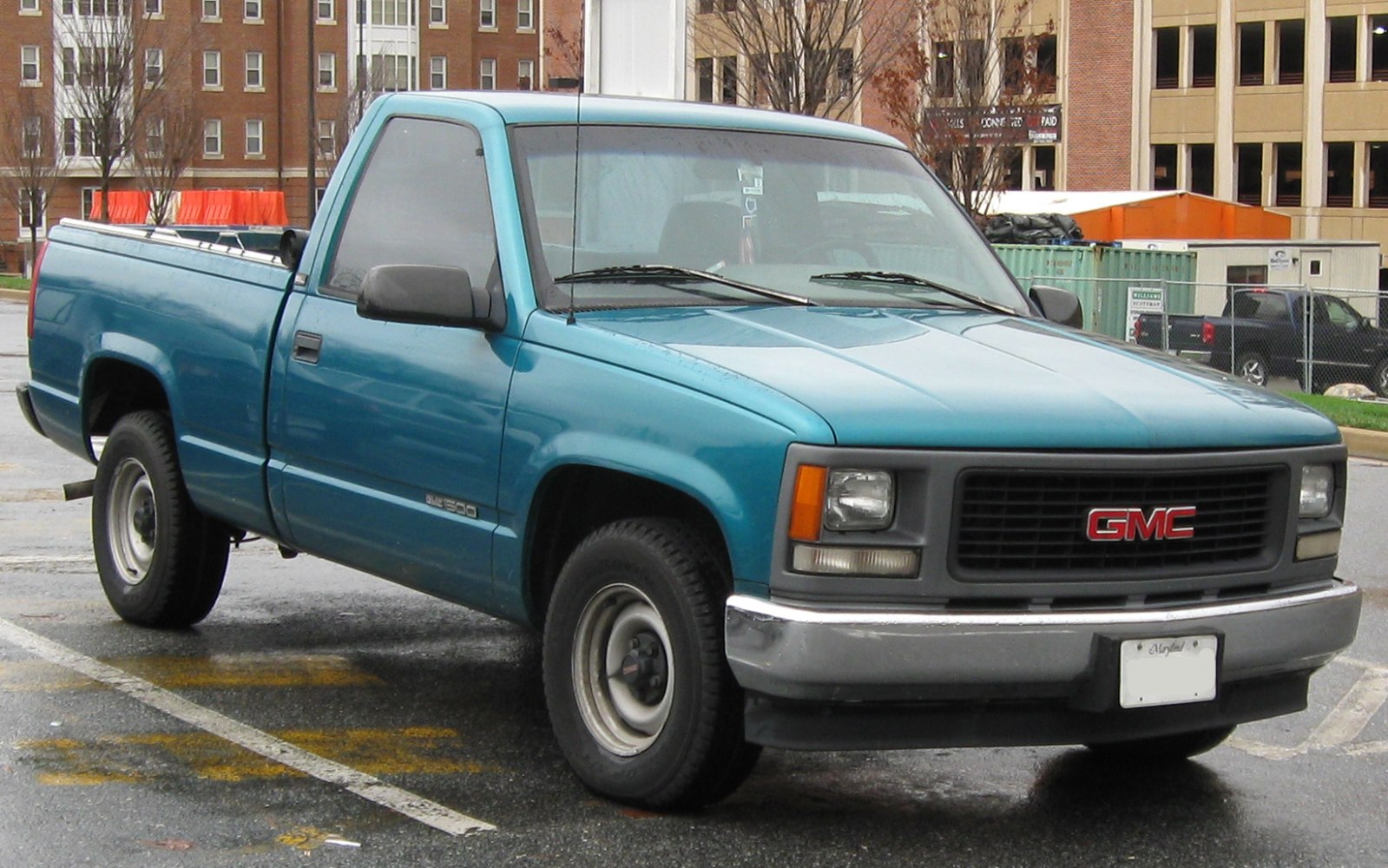 Front three-quarter view of a regular cab short bed pickup truck