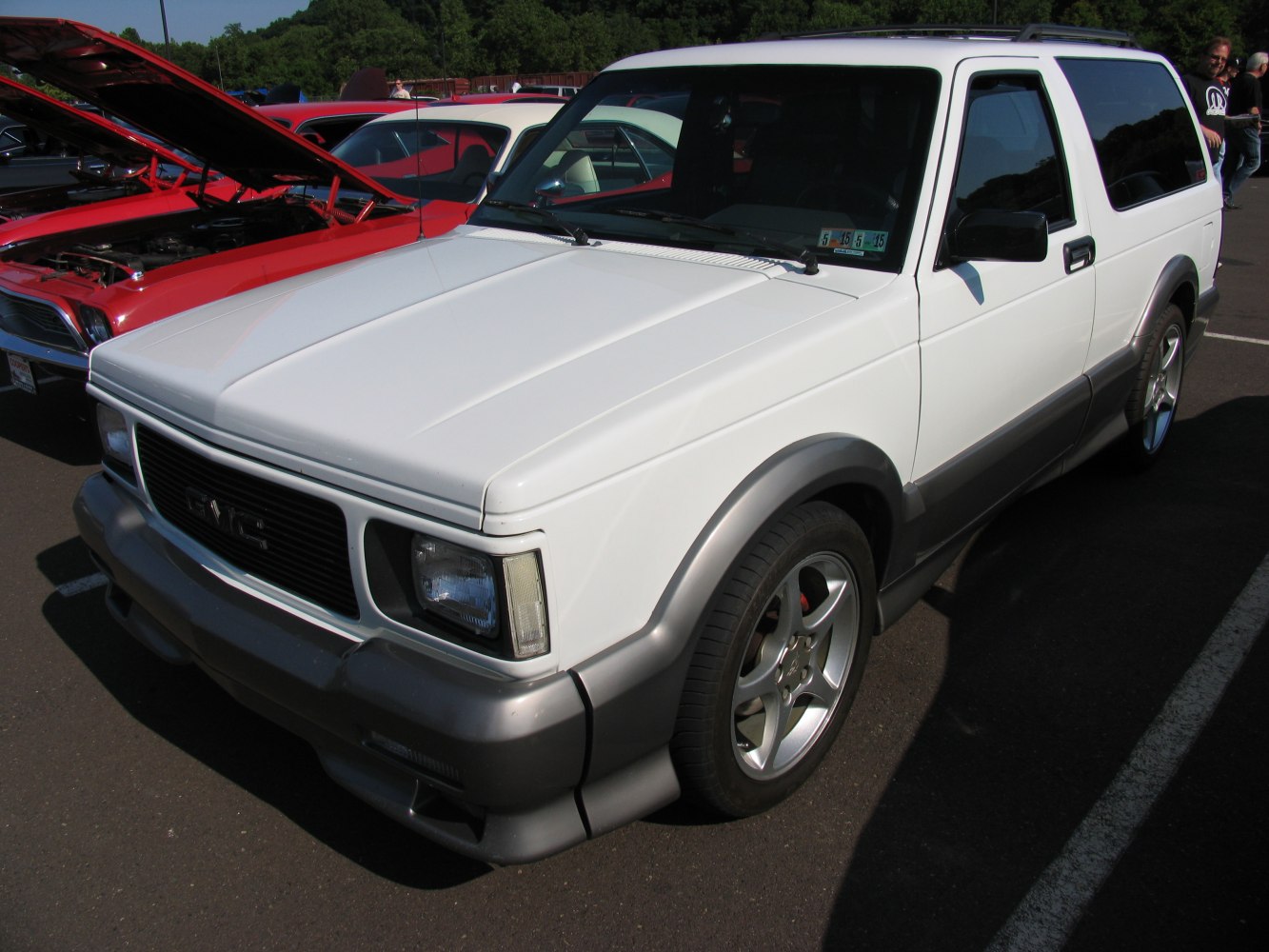 Front side view of a compact two-door SUV with distinctive styling and alloy wheels