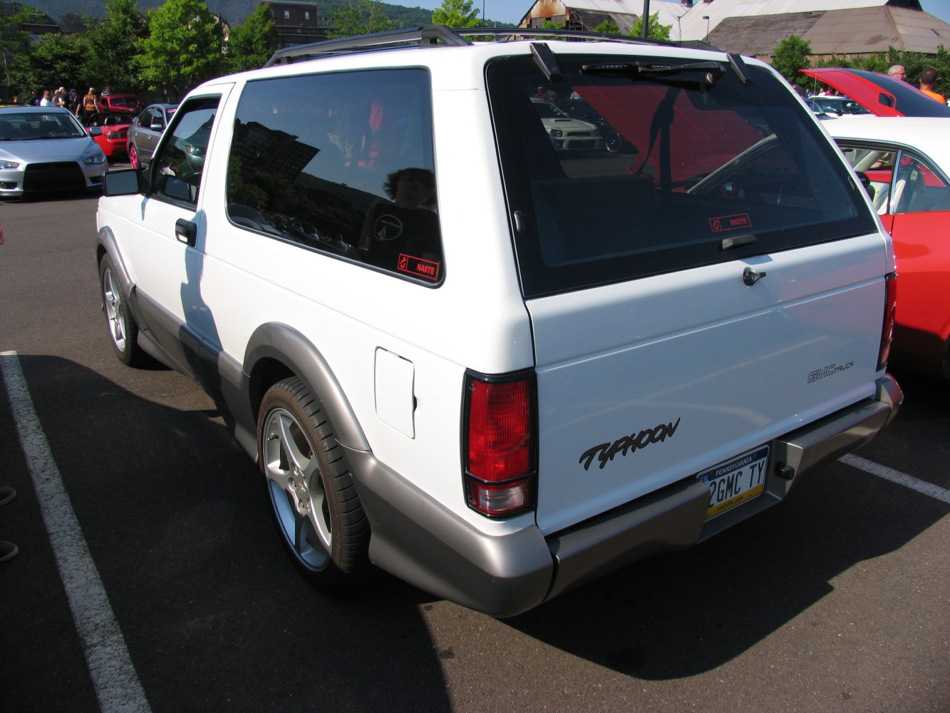 Rear and side profile of SUV with taillights and sporty wheels