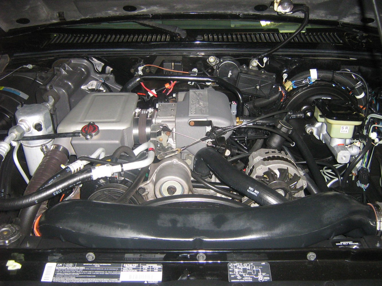 Closeup of turbocharged engine bay with prominent intake and components