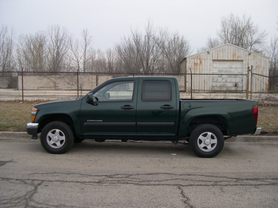 Side profile of crew cab pickup with extended bed and four doors