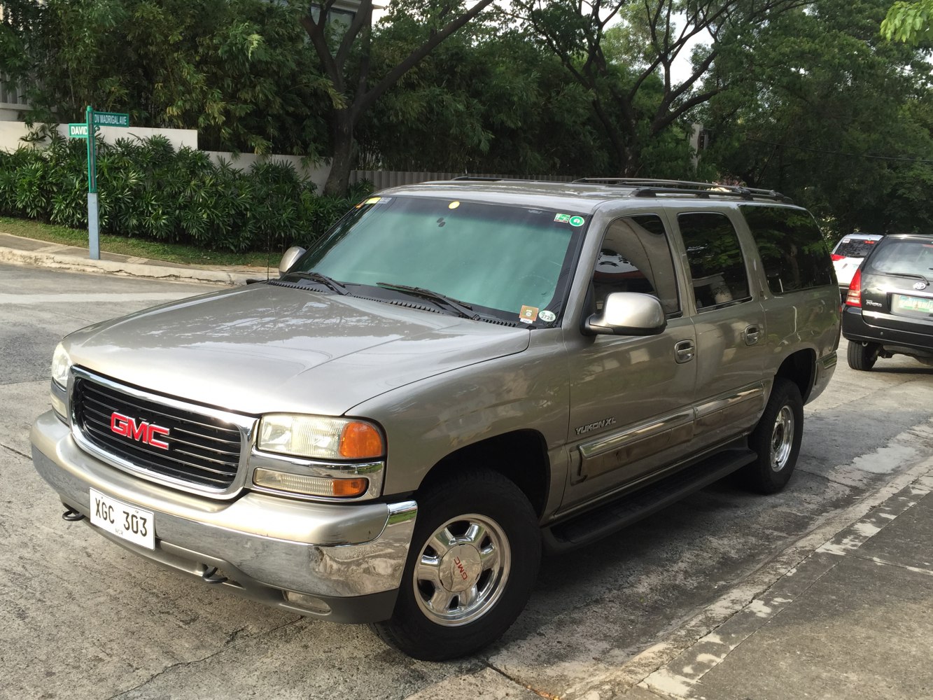 Front side angle of SUV with chrome bumper and roof rails
