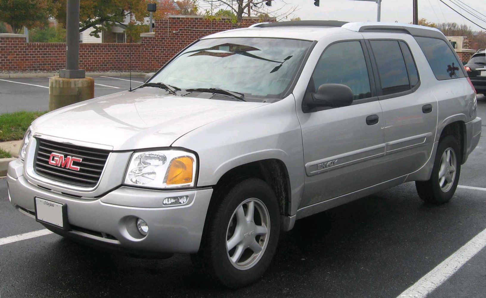 Silver mid-size SUV front side with grille and headlights