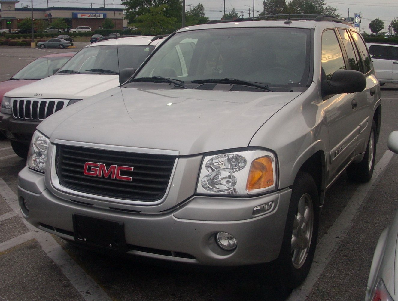 Close-up of SUV front with grille, headlights, and bumper