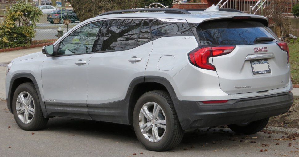 Silver SUV rear and side view with unique taillights and tinted windows
