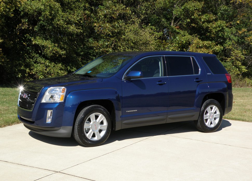 Blue SUV front side view with grille, wheels, and windows.