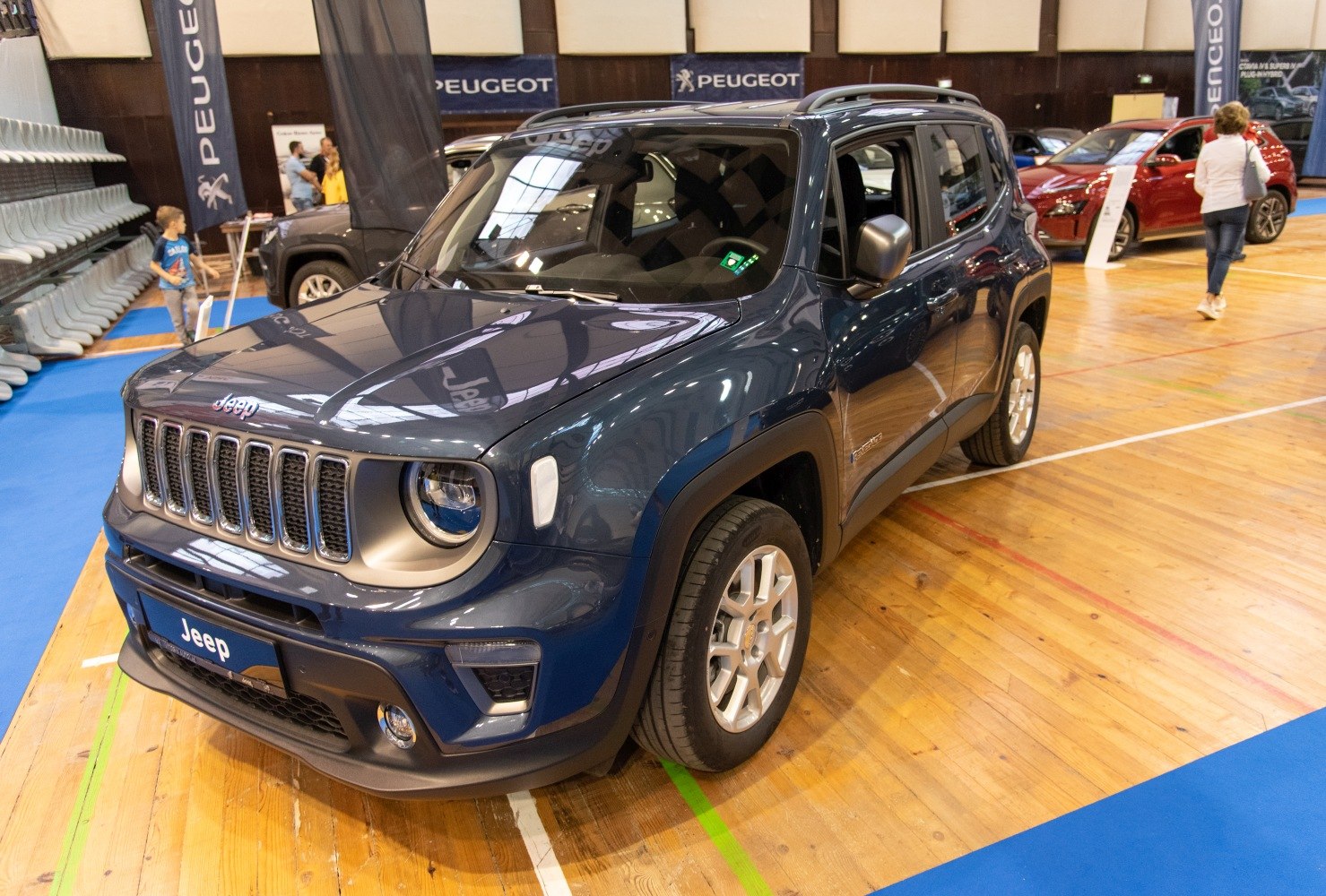 Front and side exterior view with distinctive grille and headlights