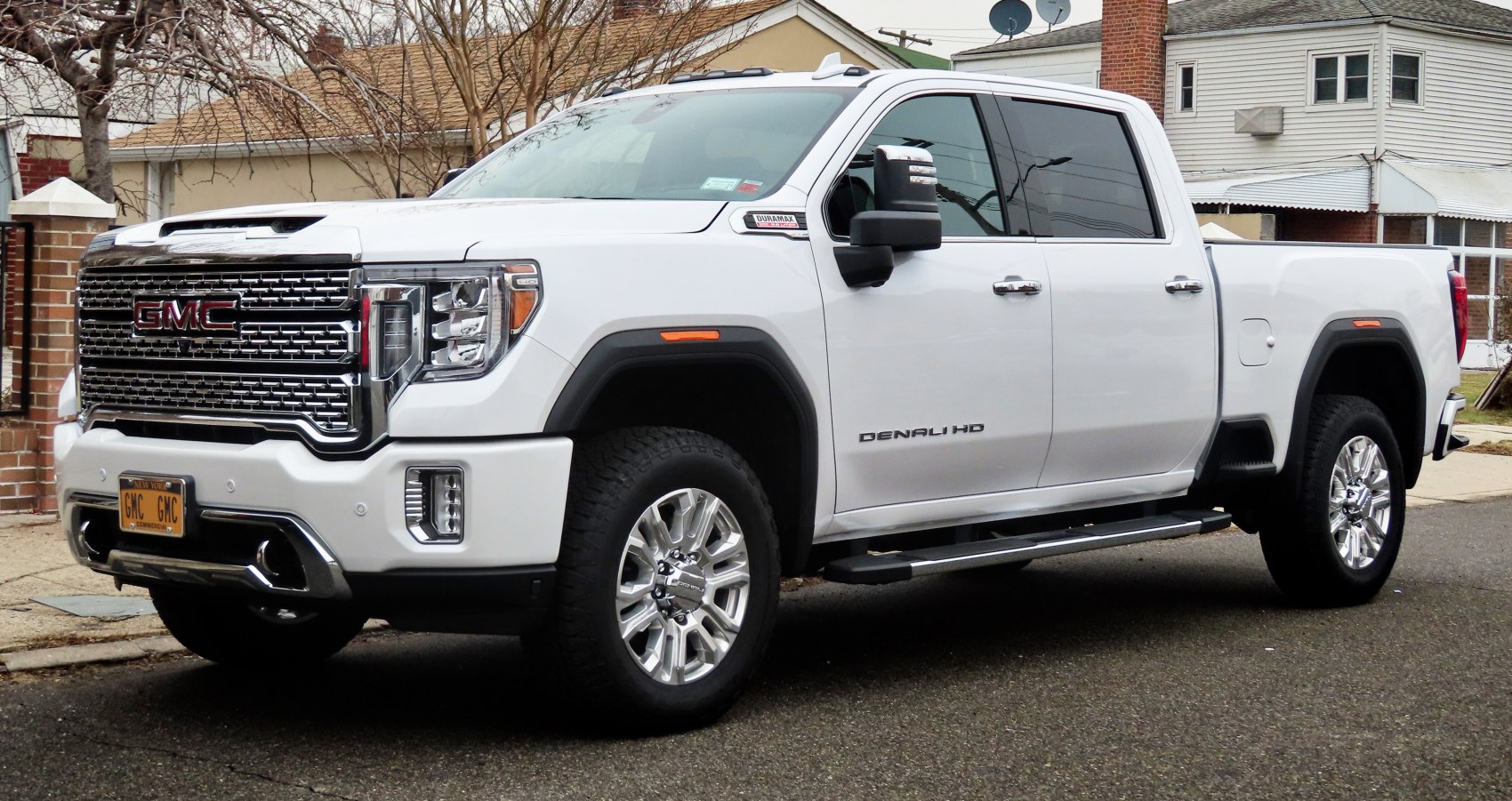 Front and side view of pickup truck with prominent grille and crew cab