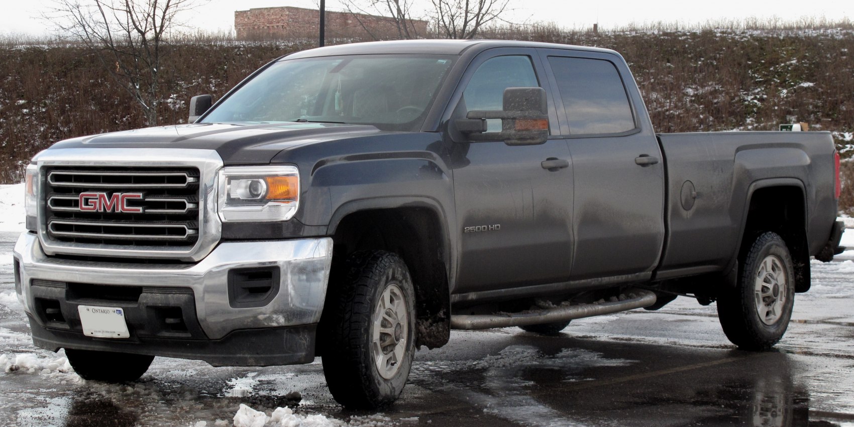 Heavy-duty pickup with crew cab and long box, rugged grille and off-road tires