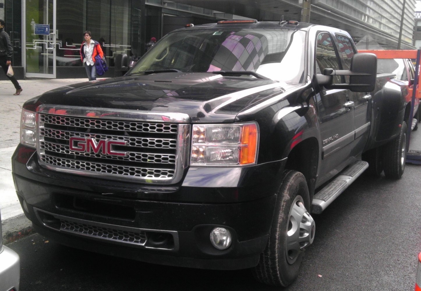 Front grille and dual rear wheels of a heavy-duty pickup truck