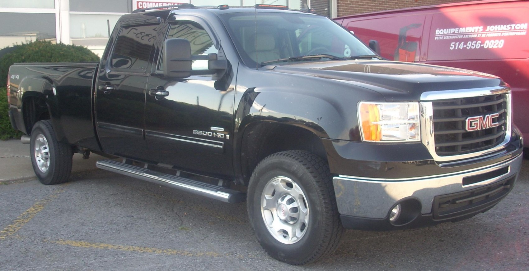 Heavy duty pickup with crew cab and long box.