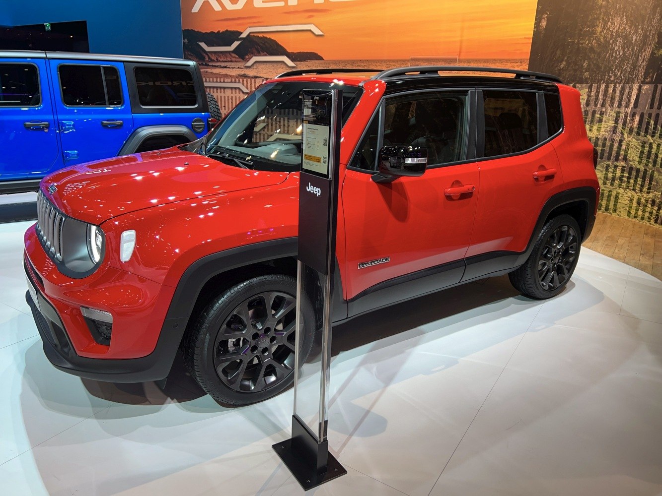 Red SUV with black alloy wheels and compact design