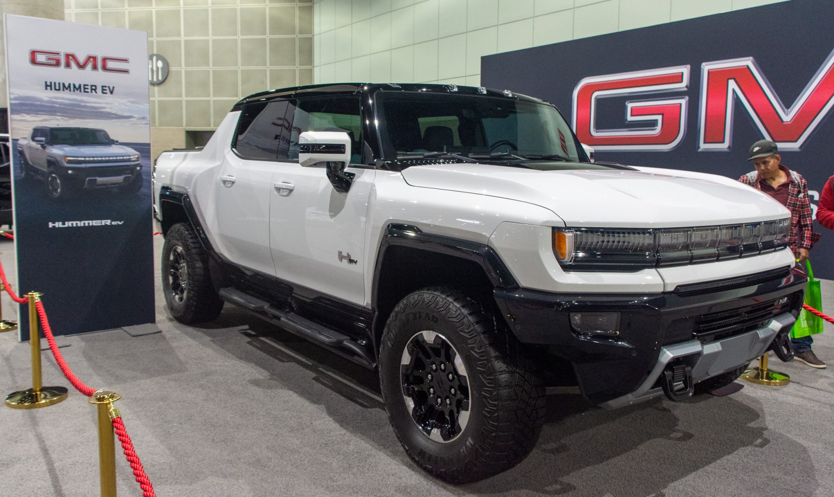 White electric pickup truck with LED headlights and off-road tires