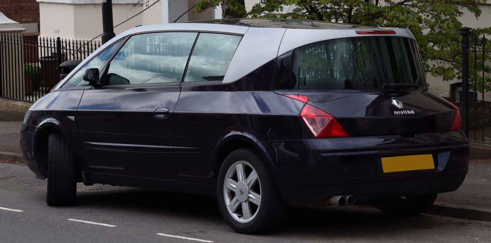 Distinctive rear design with large side windows and dual exhaust