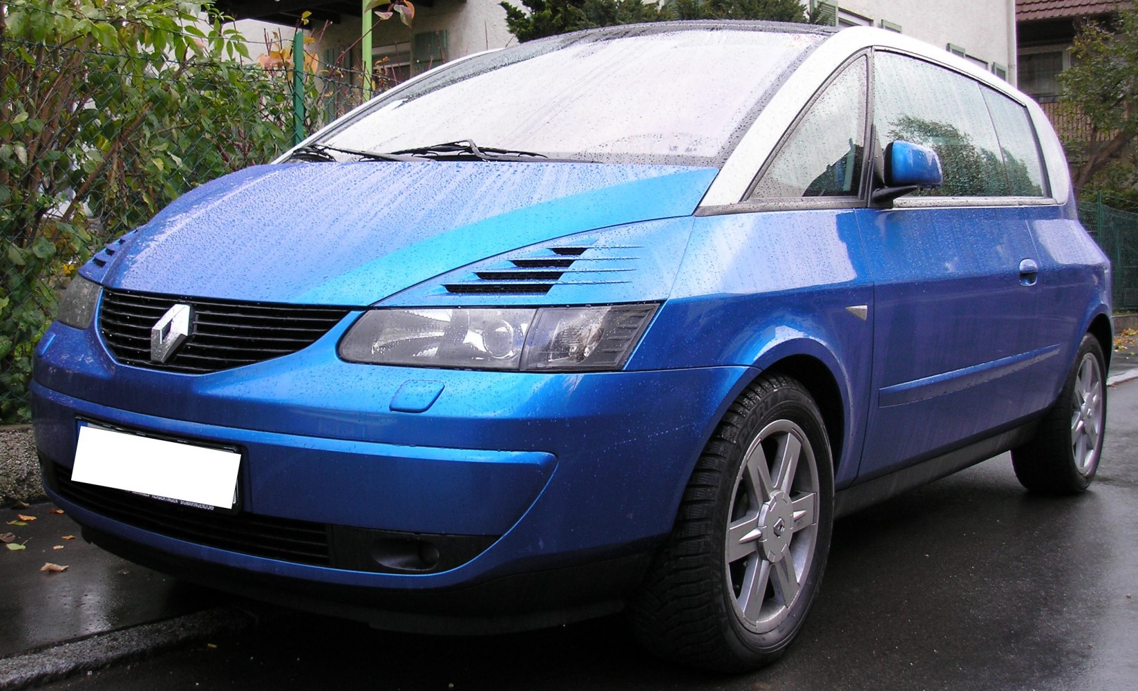 Front side perspective with headlight vents and alloy wheels