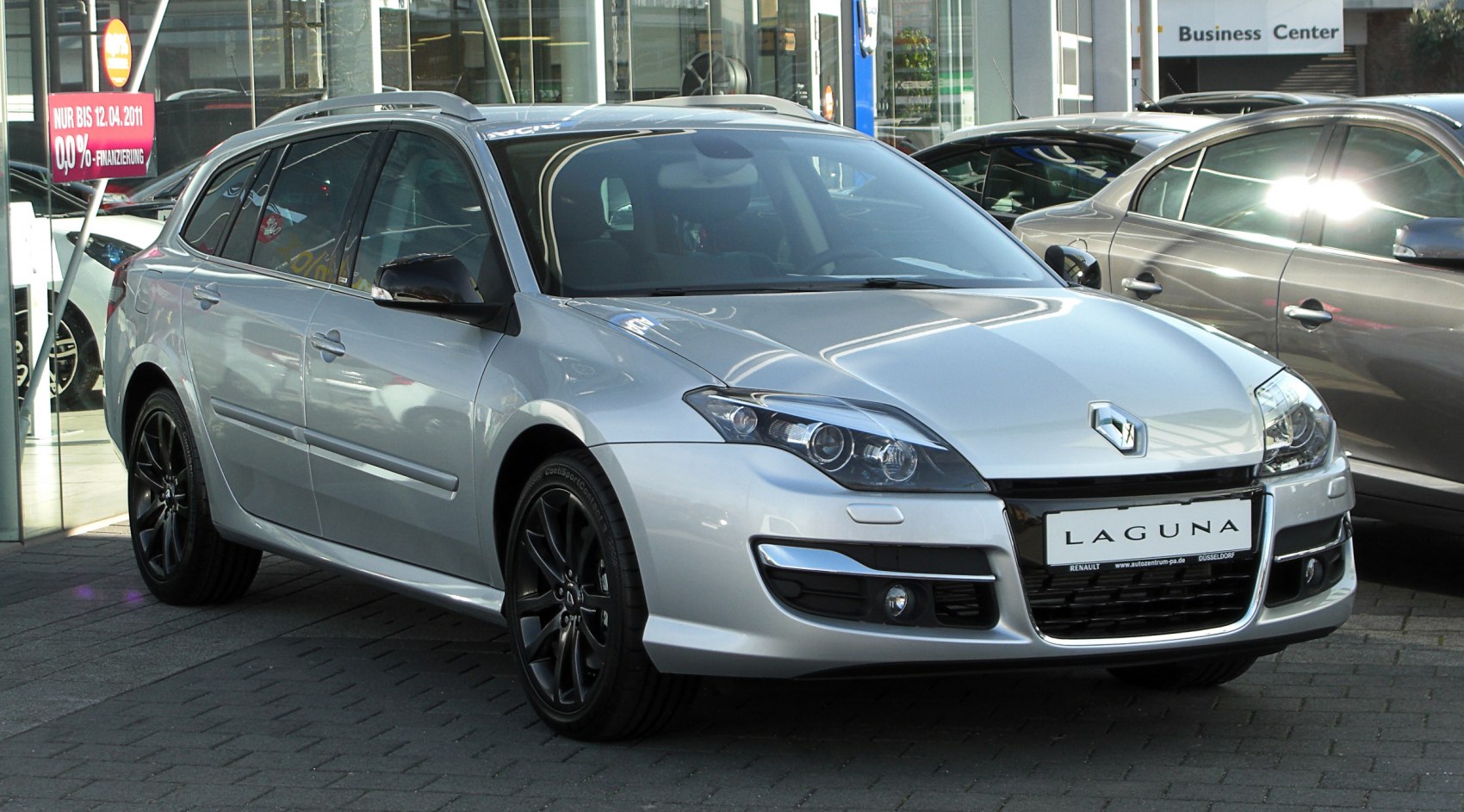 Silver station wagon front-side view with black alloy wheels