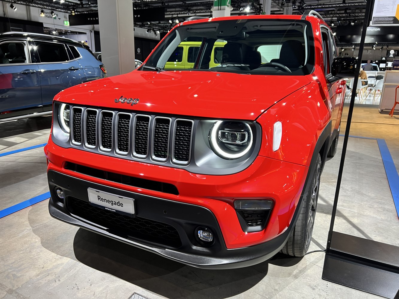 Seven-slot grille with circular LED headlight on compact SUV front.