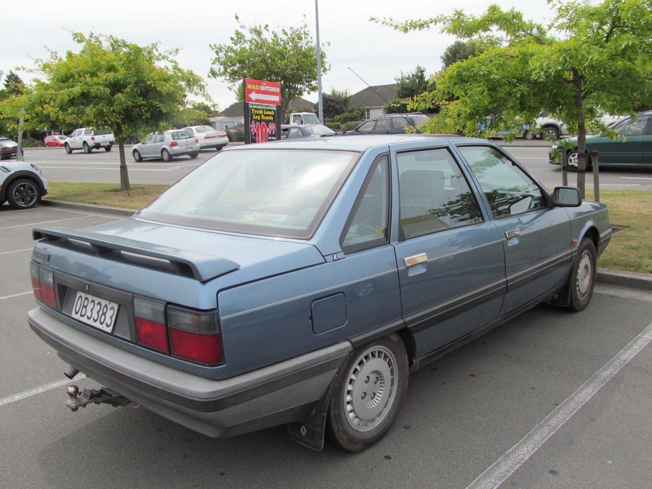 Rear view of classic sedan with spoiler and distinct tail lights