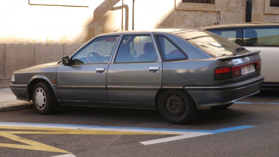 Side profile of a classic hatchback with geometric design.