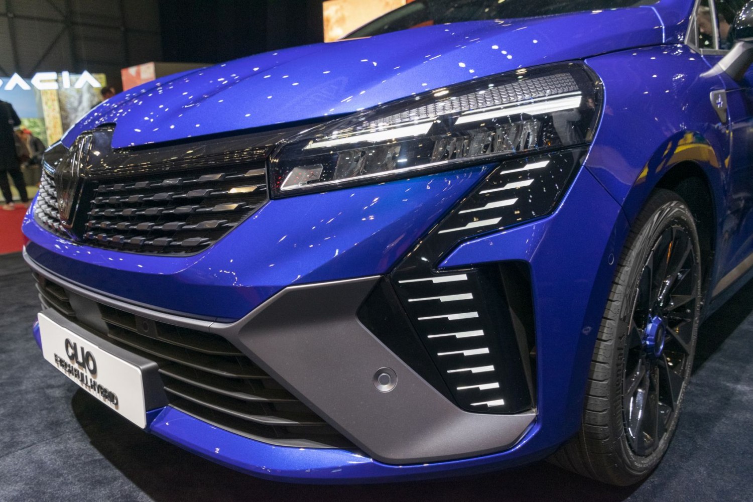 Close-up of front grille and LED headlight with daytime running lights