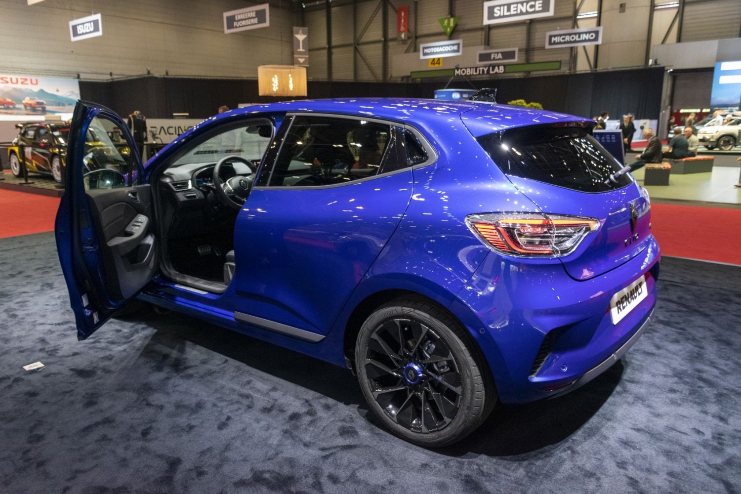 Rear and side view of hatchback with open driver door and black alloy wheels