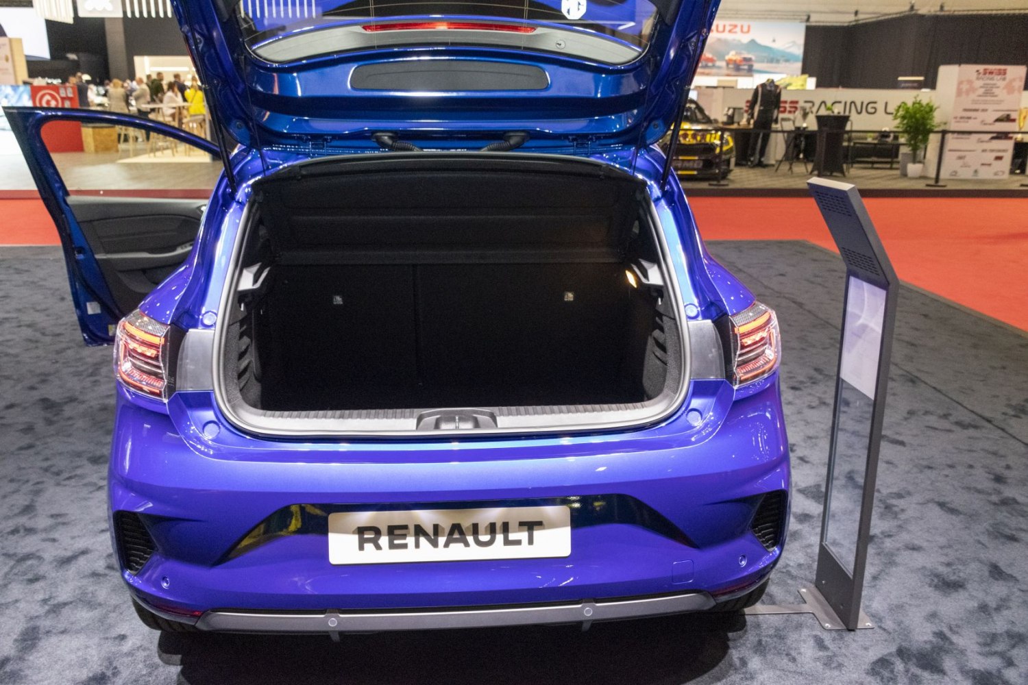Open trunk space of a modern hatchback with rear lights and hatch open