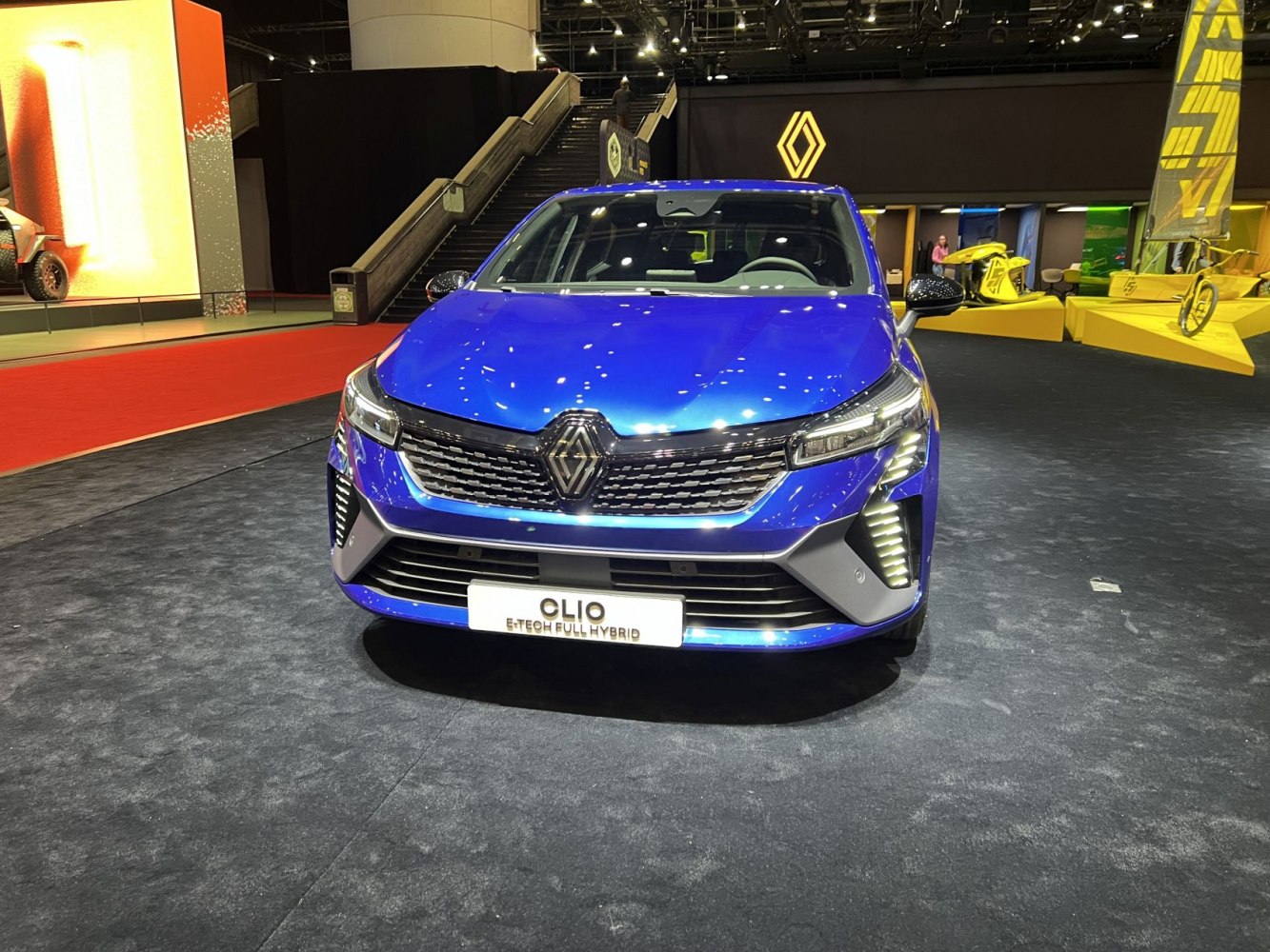 Front view of modern 2023 hatchback with hybrid badge and LED lights