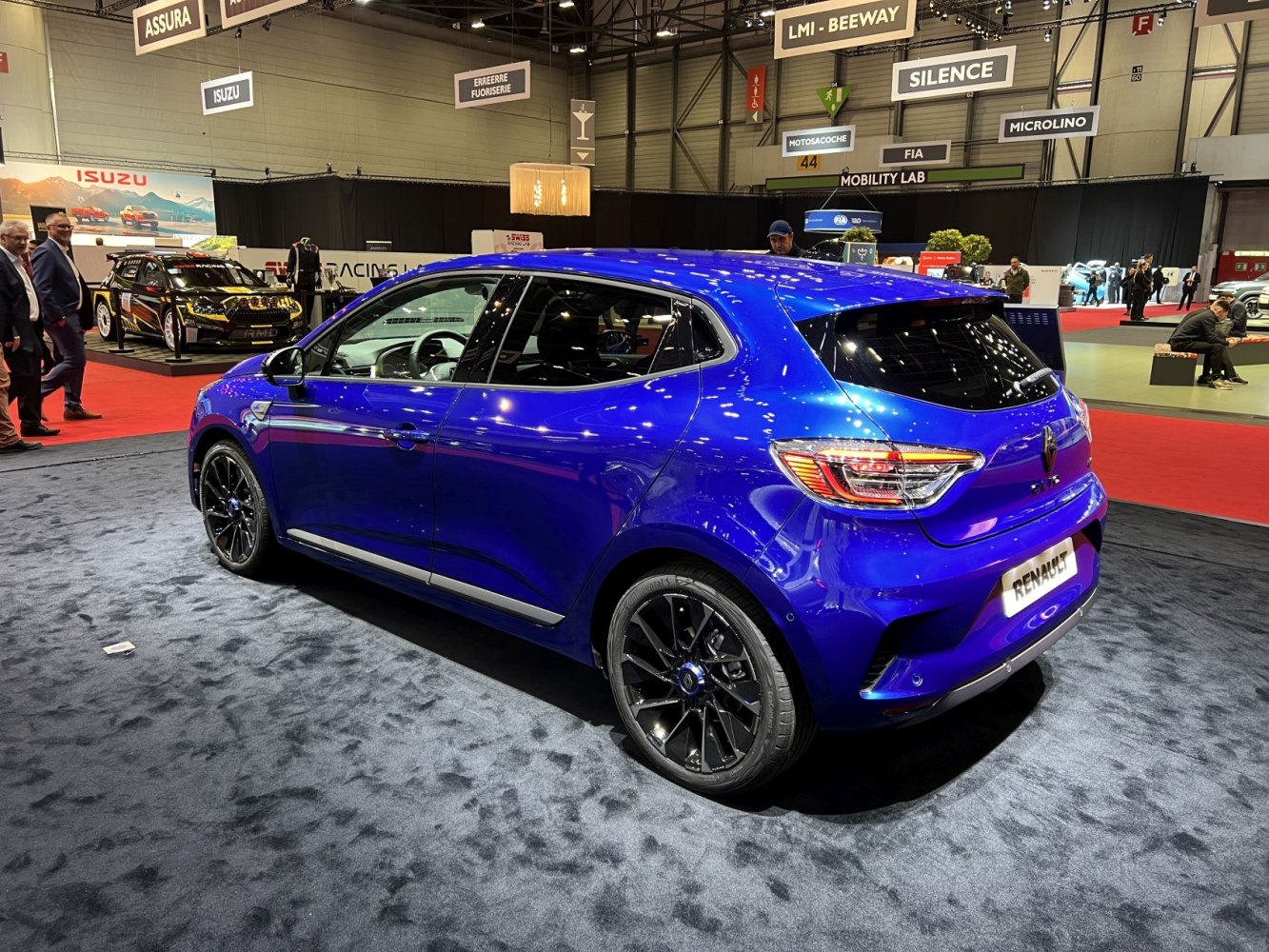 Blue hatchback rear side view with modern taillights and black alloy wheels