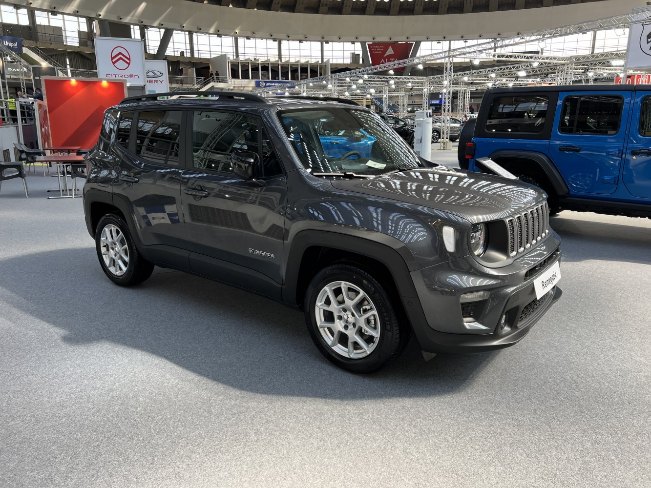 Compact gray SUV front side with seven-slot grille and alloy wheels