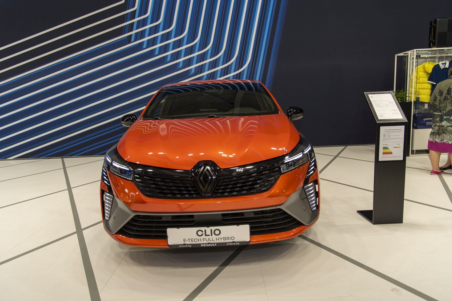 Front view showing grille and LED headlights with hybrid badge