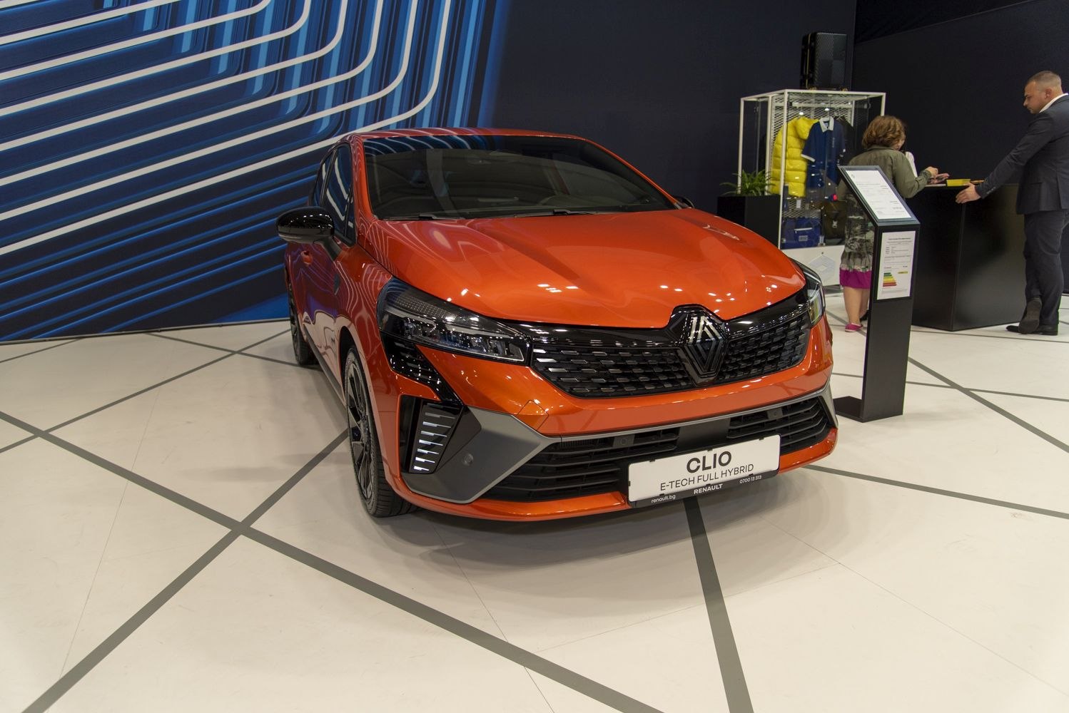 Front view of a compact hatchback with LED headlights and bold grille.