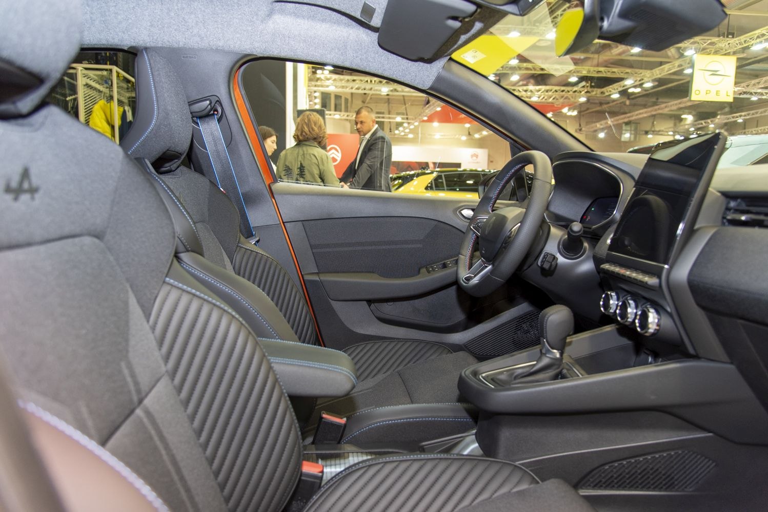Quilted seats and modern digital dashboard inside a car